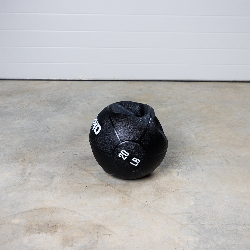 20 lb GRIND Dual-Grip Medicine Ball on floor.