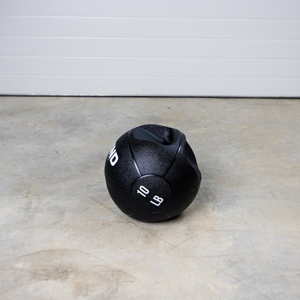 10lb GRIND Dual-Grip Medicine Ball on floor.