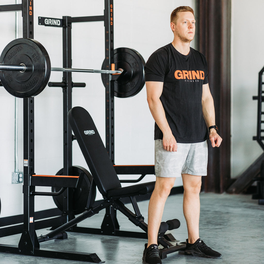 Man standing in front of GRIND Foldable Bench.