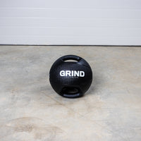 Thumbnail for Dual-Grip Medicine Ball on floor, turned so both handles are visible.