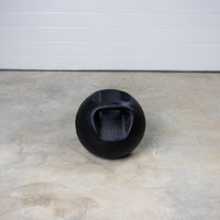Thumbnail for Dual-Grip Medicine Ball on floor with one handle visible.
