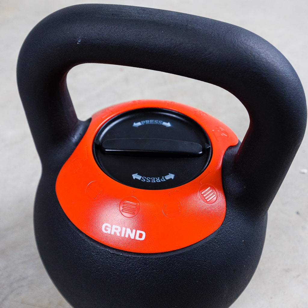 Top of GRIND Adjustable Kettlebell shown. Can adjust from 20 to 40 in five pound increments by pushing down and turning to lock in.