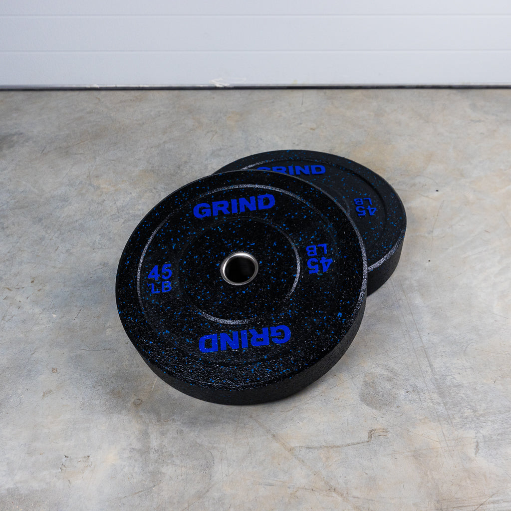Blue 45lb GRIND Fitness Black Carbon Weight Plates with Blue Colored Fleck pieces in each plate.