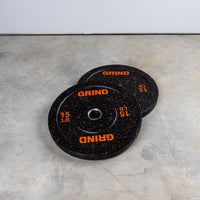 Thumbnail for Orange. 15lb GRIND Fitness Black Carbon Weight Plates with Orange Colored Fleck pieces on each plate.