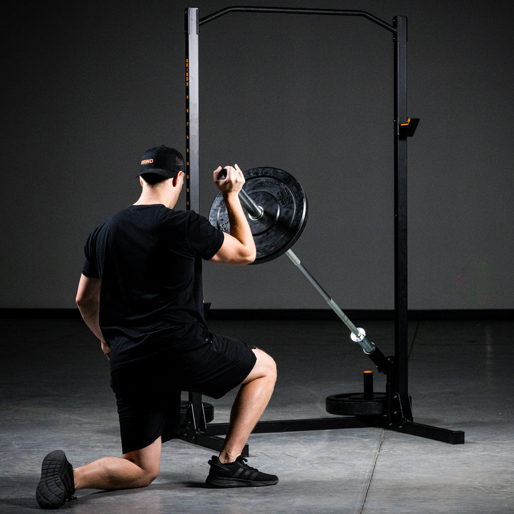 Man demonstrating using landmine when using barbell storage on rack