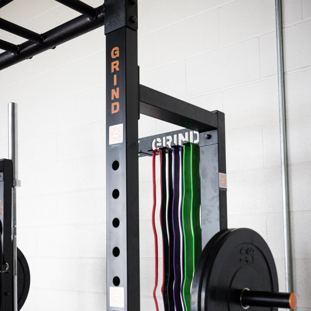 Resistance bands hanging from storage unit.