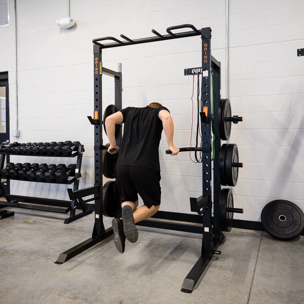 Man doing tricep dip using Dip Handles on Chaos4000 rack