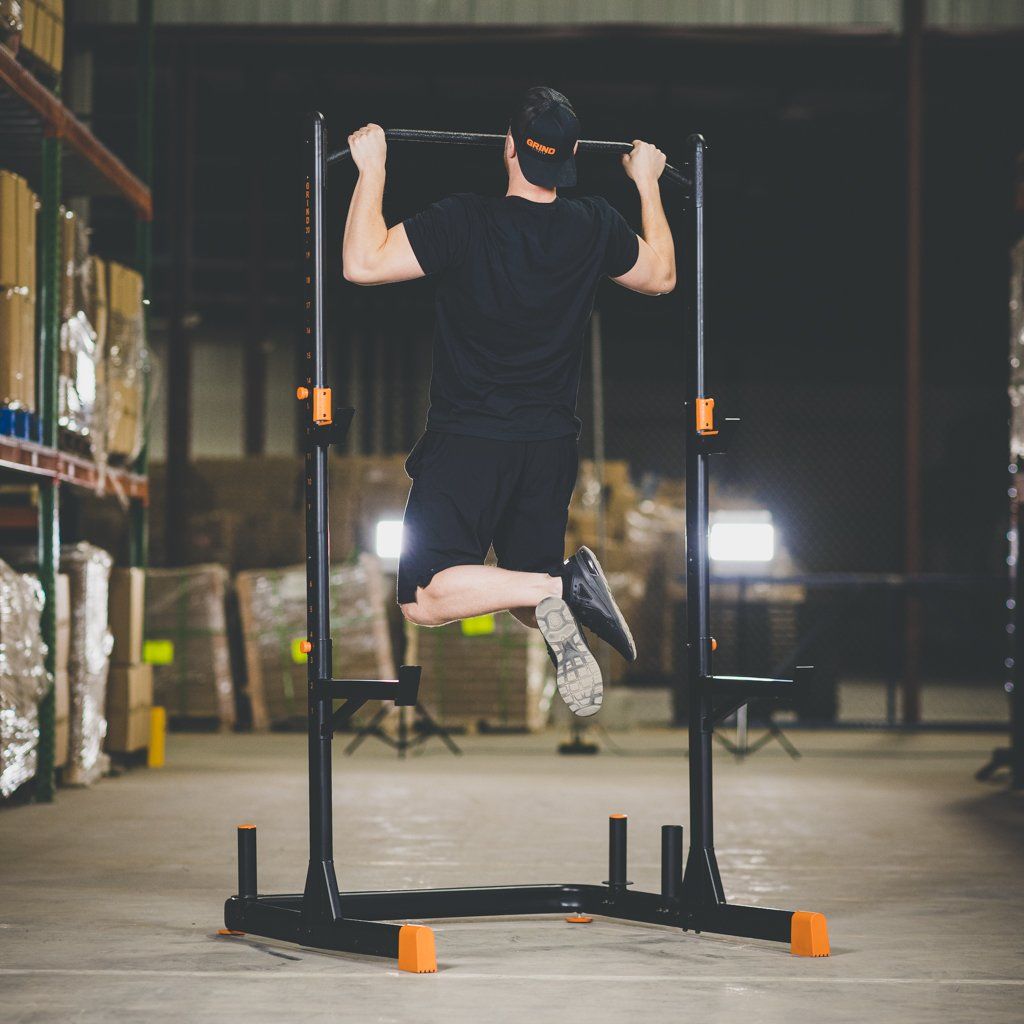 Man performing a Pull Up on The GRIND Fitness Alpha2000 Squat Stand